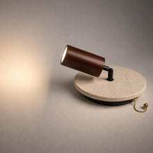 Brim Travertine 2-in-1 indoor wall light with dark wood cylindrical shade, brass pull cord, and soft directional light.