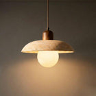 Flint natural stone pendant light with a light-colored, textured dome shade, walnut timber top, and glowing G9 globe.