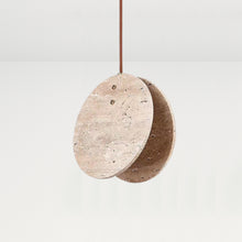 Nacre Travertine Pendant Light, featuring two round, hand-shaped stone discs with a brown cord.