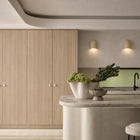 Wisp Travertine Curved Up or Down Wall Light in Natural